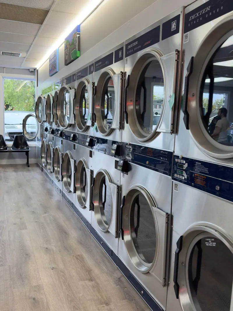Rows of commercial dryers inside New Paltz Express Laundry